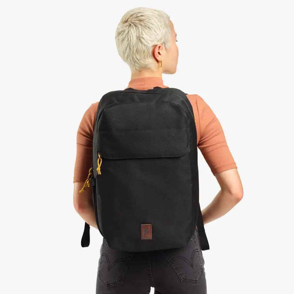 Ruckas Backpack 23L Black. This 23L backpack is all about access. Easily get to your gear through the side or top with its 3/4 length main zipper. Made from recycled materials. Stow the essentials, and be ready for the day.